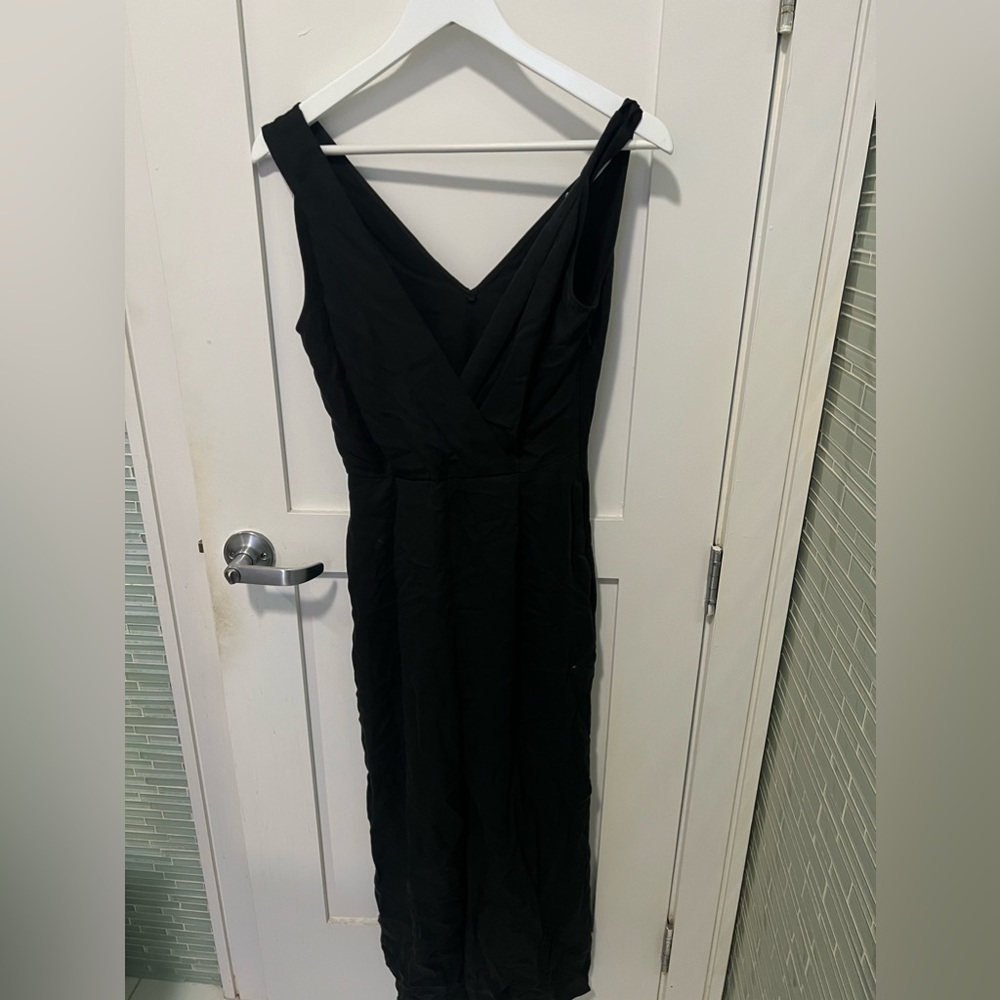 Black mango jumpsuit with zip up the side. Size XS